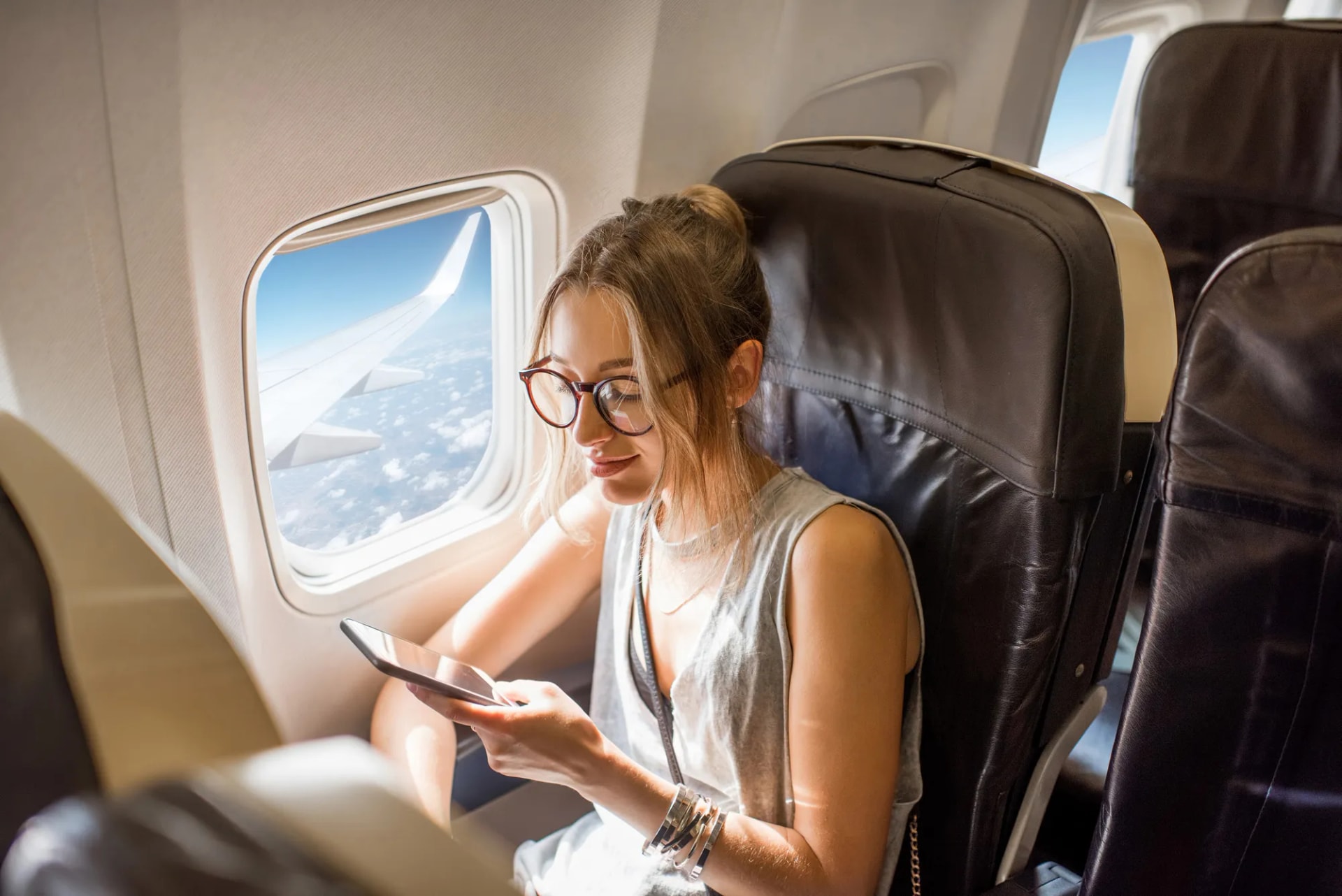 In-flight travel using a secondary phone number